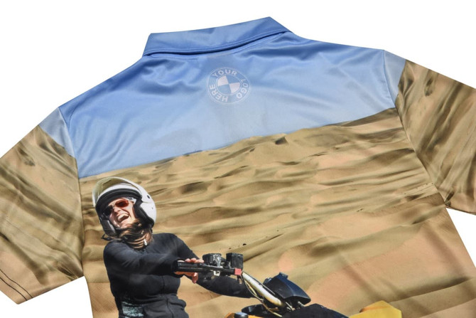 A shirt featuring a vibrant landscape design with a motorbike theme, primarily in blue and beige tones.