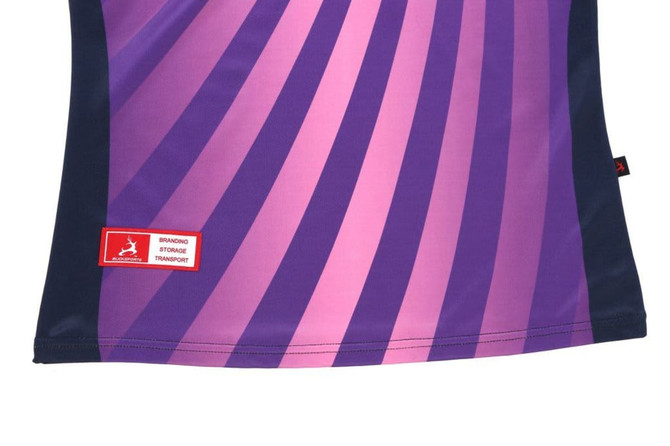 A ladies' polo shirt featuring a vibrant gradient of purple and pink stripes, with a logo at the hem.