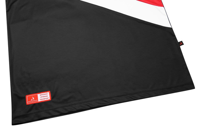 A black, red, and white promotional product featuring a logo in one corner and a sleek, modern design.