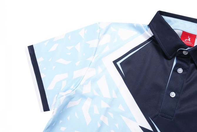 A polo shirt featuring blue and navy geometric patterns, with a collared design and buttons. Includes a logo.