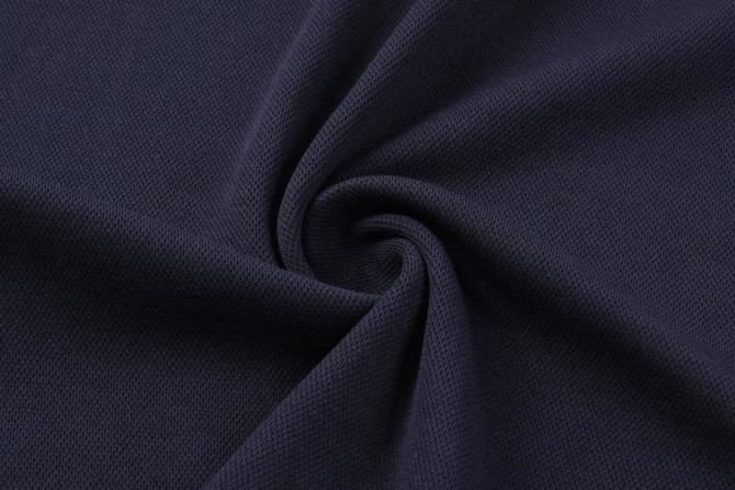 A dark navy fabric with a textured surface, featuring a subtle pattern and smooth finish.