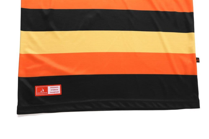 A striped polo shirt featuring orange, black, and yellow colours, with a small branding logo on the bottom.