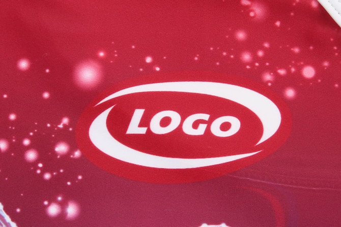 A red athletic running suit featuring a prominent logo. The design includes a vibrant, speckled pattern.