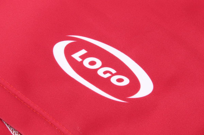 A red running suit featuring a prominent logo. Ideal for various sports activities.