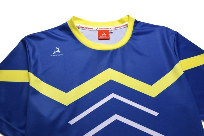 A blue sports tee with yellow accents and a zigzag design, featuring a logo at the top.
