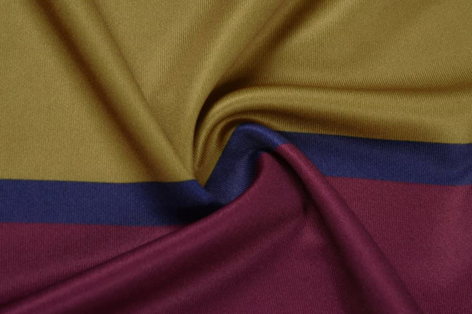 A fabric featuring olive green, navy blue, and burgundy stripes, showcasing a soft, smooth texture.