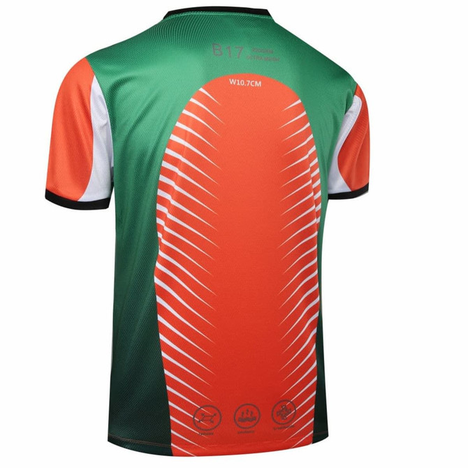 A custom esports t-shirt featuring a green and orange design with white accents and a logo.