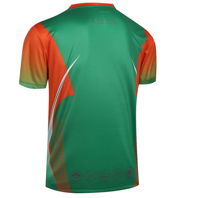 A custom-made T-shirt featuring a vibrant green and orange design, with a logo and dynamic lines.