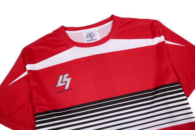 A red uniform t-shirt with white accents and horizontal black stripes, featuring a logo on the front.