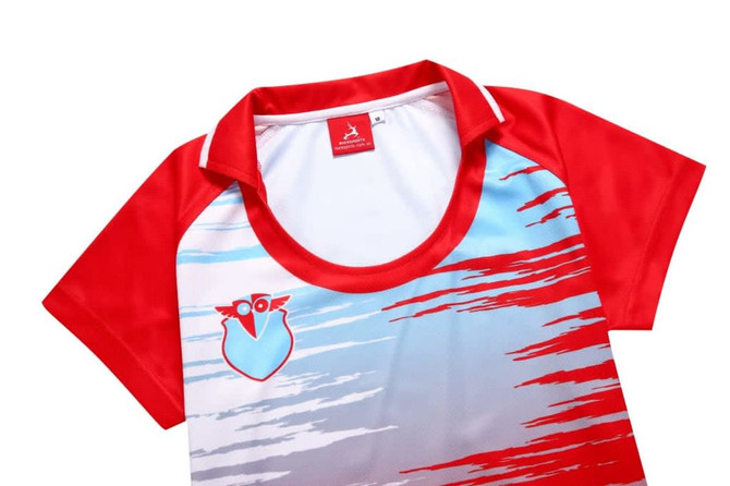 A red and white women's t-shirt featuring a collar and a logo, with a gradient design in blue tones.