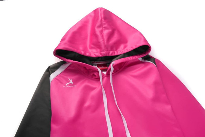 A pink hoodie with a black and grey design, featuring a hood and drawstrings, plus a logo.