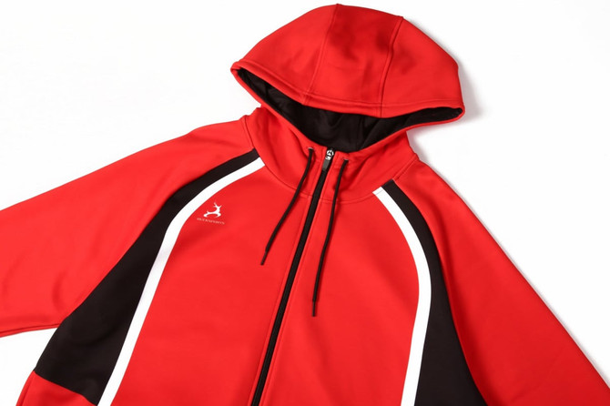 A red sports hoodie with black and white accents, featuring a zip and a hood. It has a logo on the chest area.