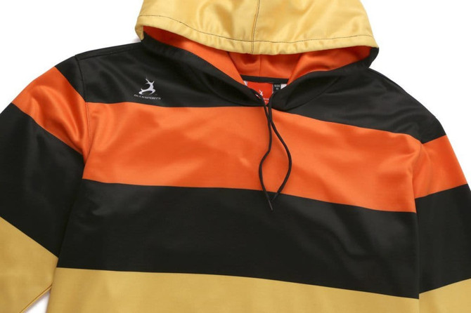 A kangaroo hoodie featuring bold black, orange, and yellow stripes with a logo on the chest.