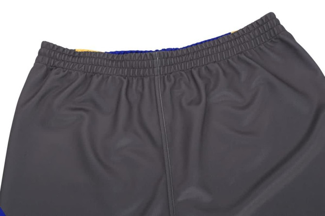 A pair of grey shorts with a waistband and blue accents, displaying a branding logo.