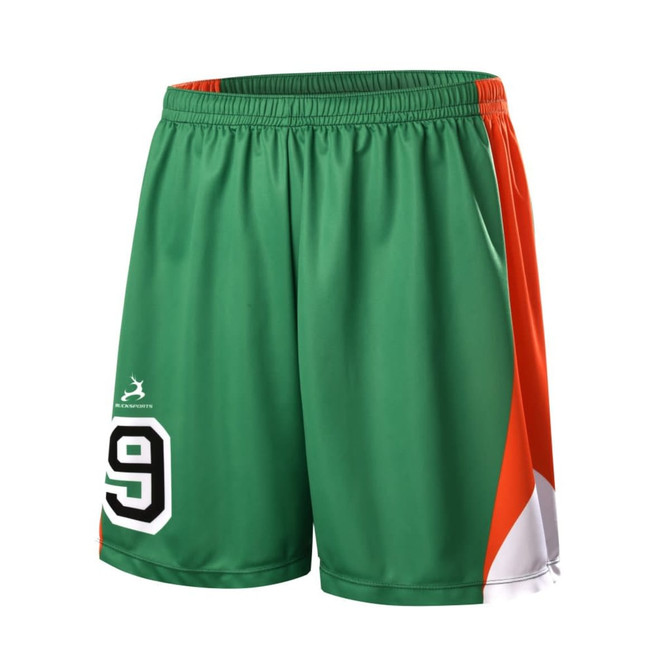 Green and orange junior soccer shorts featuring a number 9 and a logo on the side.