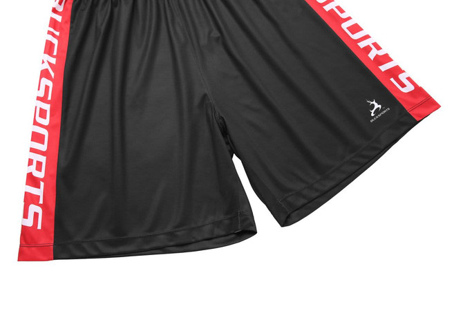 A pair of black shorts with red side stripes and a logo.