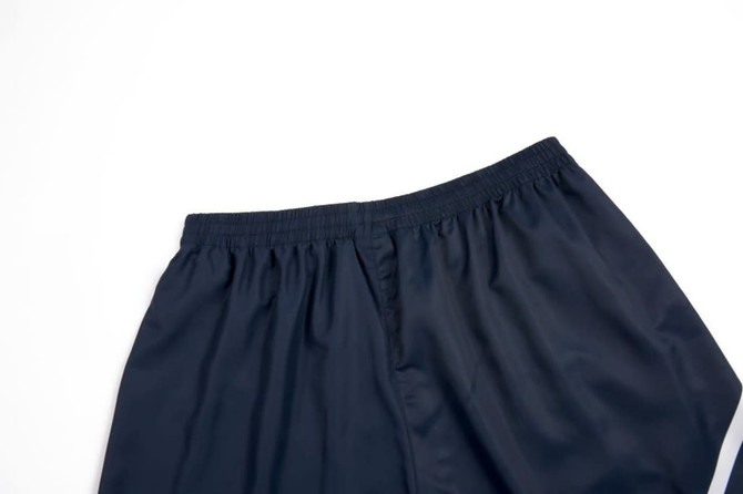 Navy woven school shorts with an elastic waistband and a smooth finish, featuring a logo on the waistband.