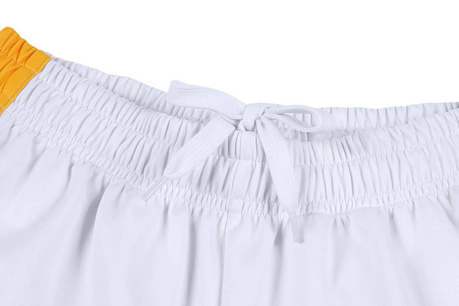 White cricket uniform pants for women, featuring an elastic waistband with a drawstring and orange detailing.