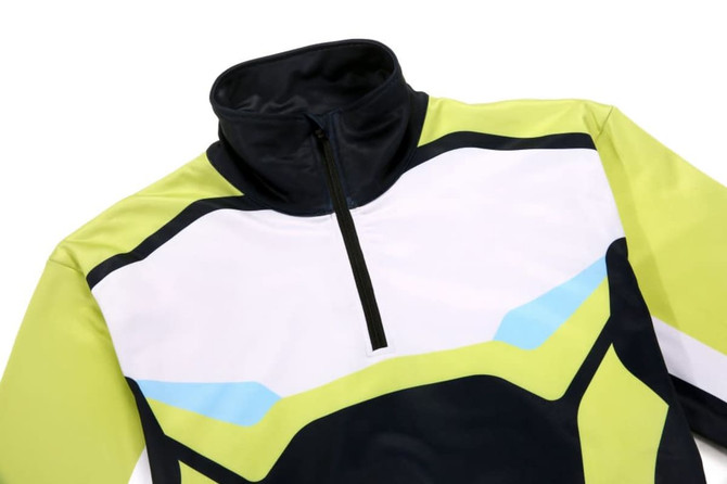A thick pullover quarter zip in lime green, white, and black, featuring a contrasting design and a zipped collar.