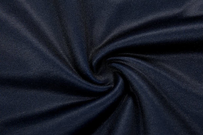 A thick, navy fabric in a swirling pattern, showcasing a smooth texture suitable for a pullover quarter zip product.