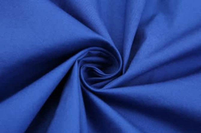 A blue fabric twisted in a spiral, showcasing its smooth texture and vibrant colour.