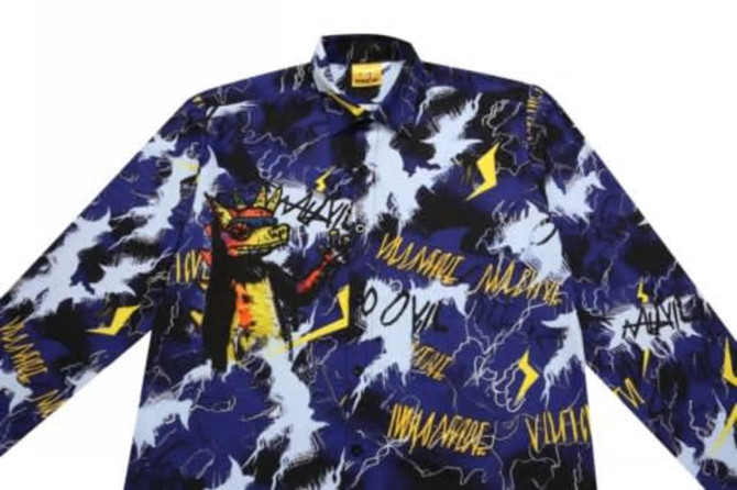 A vibrant blue and black jacket featuring a pattern of yellow lightning bolts and abstract designs. It has a logo on the collar.