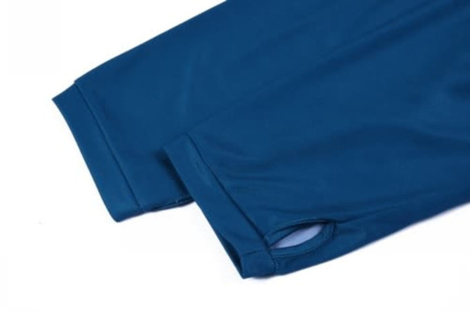 Blue UPF 50 sports jersey featuring long sleeves and a logo. The material appears smooth and lightweight.