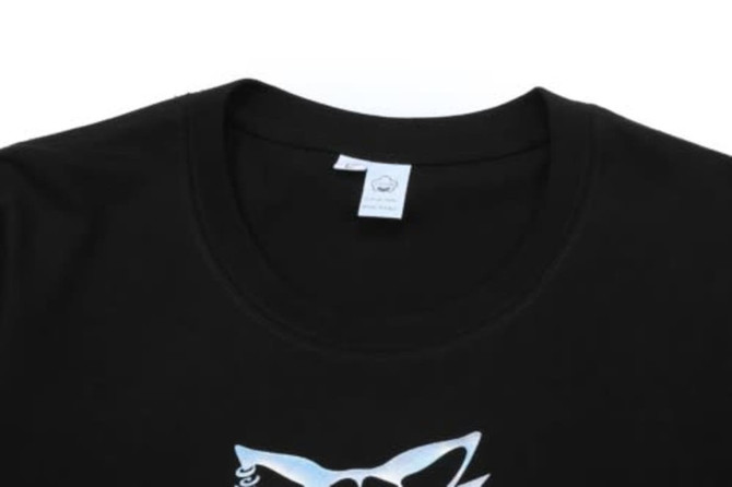 A black cotton t-shirt featuring a round neckline and a logo on the front.