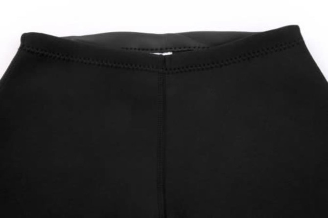 A black anti-chlorine swimming coat with a smooth finish and detailed stitching at the waistband. It features a logo.