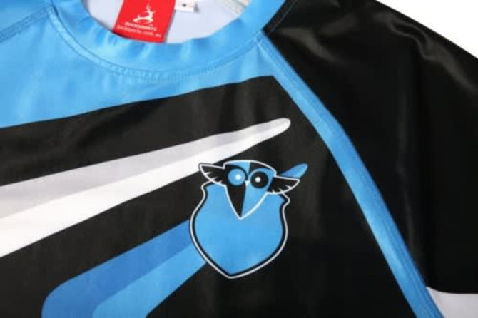A sports uniform featuring a blue and black design with a logo on the chest, suitable for swimming teams.