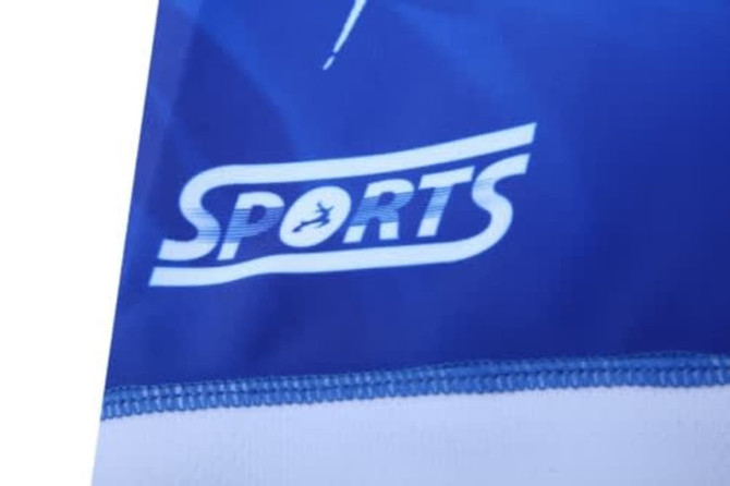 A blue sports uniform featuring a white logo, designed for swimming teams and resistant to chlorine.