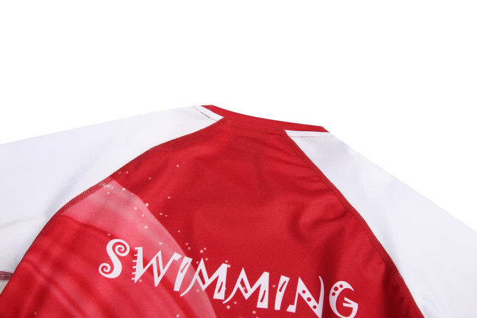 A red and white swimming garment with a logo, featuring a high neck and short sleeves.