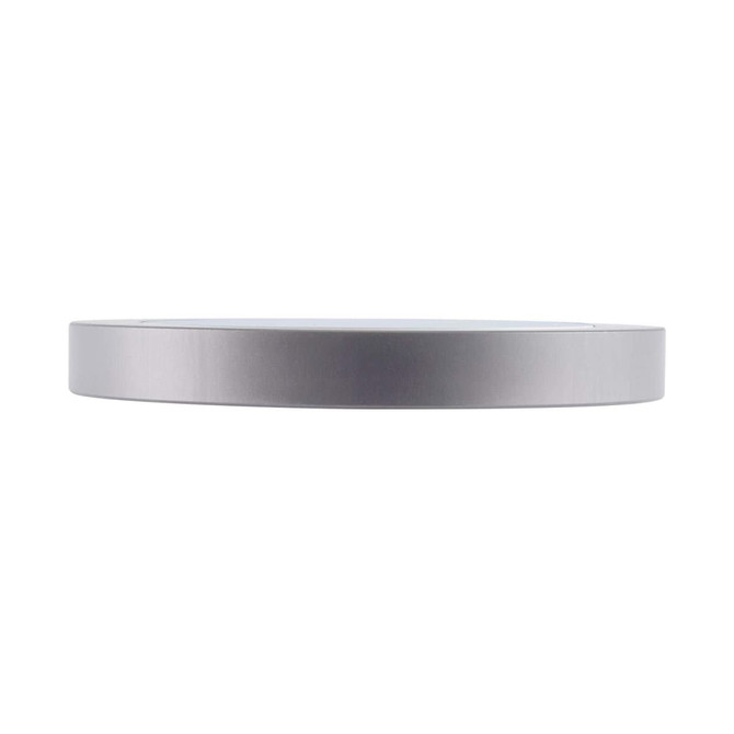 A sleek silver wireless charger with a minimalist design and a round shape. It features a logo on the surface.