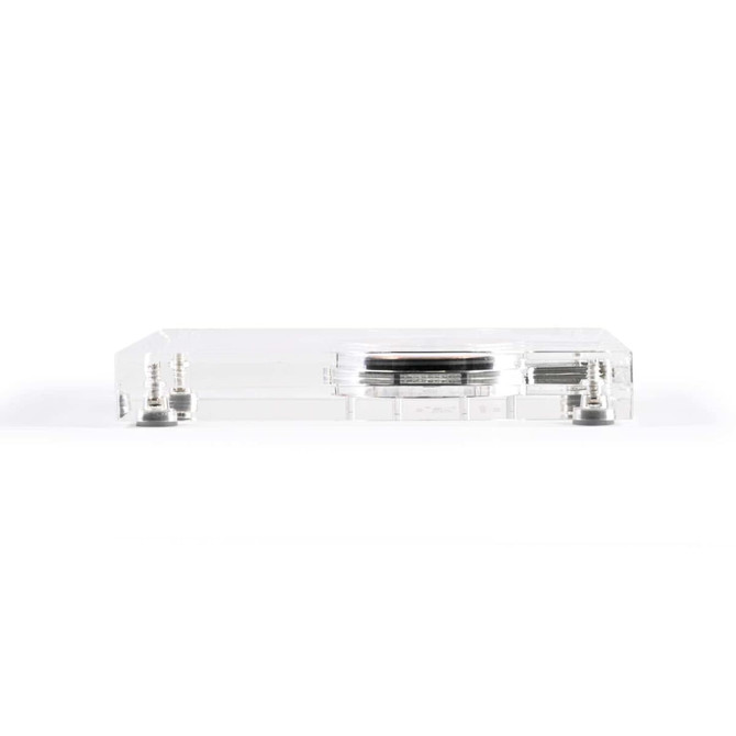 A clear crystal wireless charger with a sleek design and metallic accents. It features a logo on the surface.