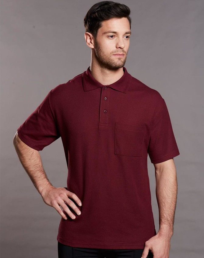A maroon short sleeve polo shirt with a pocket and a logo on the chest.