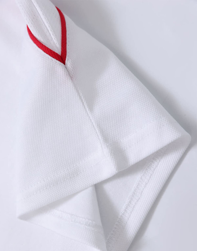 A white polo shirt featuring red accents on the sleeves and a logo.