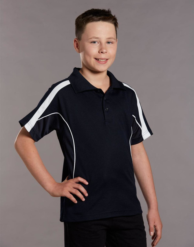 A young boy wearing a navy blue polo shirt with white accents and a logo. The shirt has a classic collar and short sleeves.