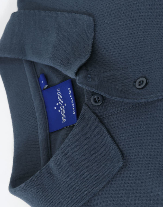 A dark blue cotton stretch polo shirt featuring a collar and buttons, with a visible brand tag.