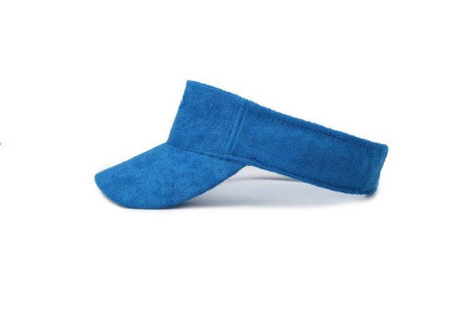 A blue soft peak visor featuring a textured fabric and a wide brim, designed for headwear.