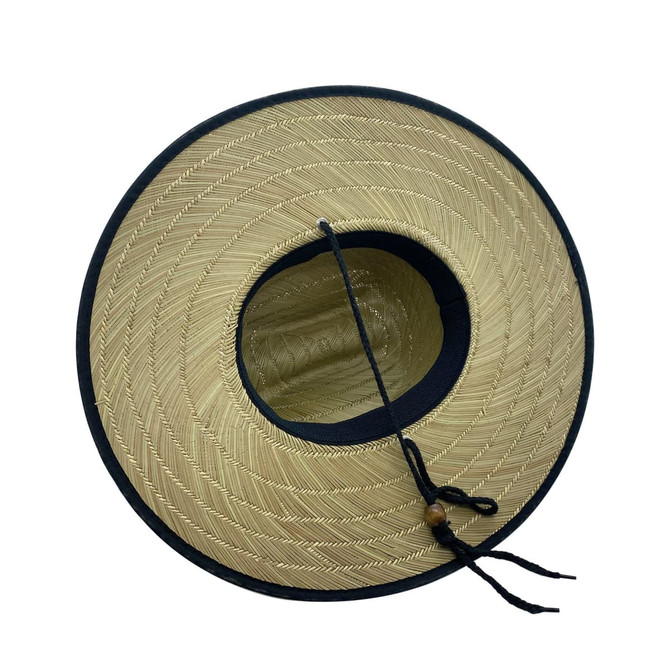 A tan bucket hat with a wide brim and a dark blue trim, featuring a logo and drawstring.