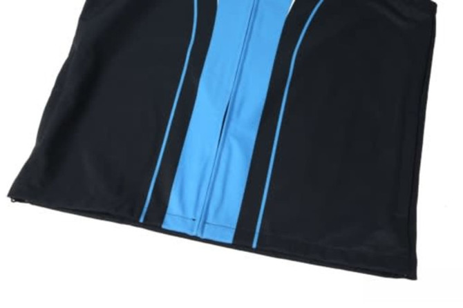 A soft shell waistcoat featuring black fabric with a blue stripe down the middle and a front zipper. It has a logo.