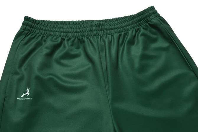 Green sweatpants featuring an elastic waistband and a logo on the side.