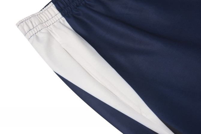 School track pants featuring navy blue and white panels, with an elastic waistband and a logo.