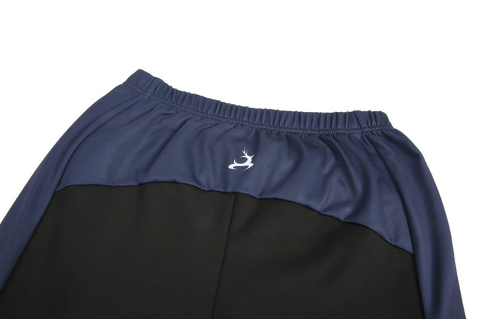 Side zip warm-up pants in dark green and navy, featuring an elastic waistband and a logo on the waistband.