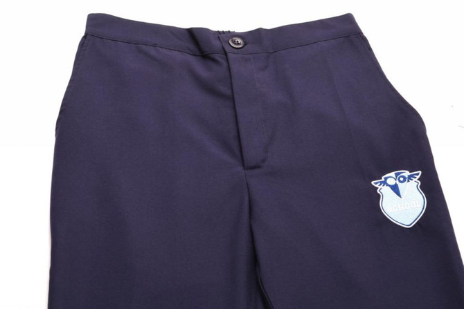 A pair of navy warm-up pants featuring a logo on the side. The pants have a button closure and a sleek design.