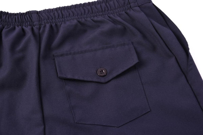 A pair of navy blue warm-up pants featuring an elastic waistband and a buttoned side pocket.