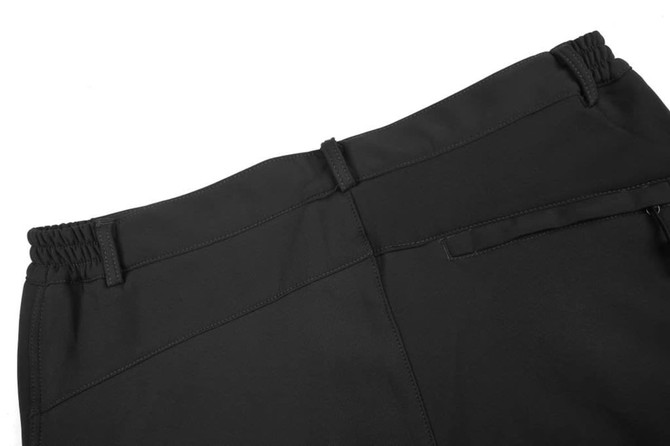 Black softshell pants with an elastic waistband and pockets, featuring a small logo on the back.