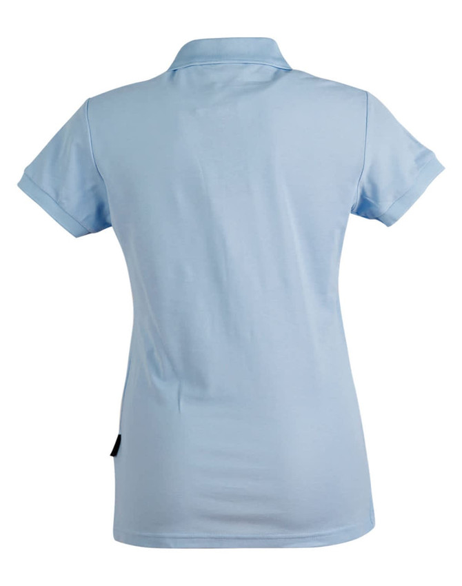 A light blue ladies' polo shirt featuring a collar and rolled sleeves, with a logo on the side.