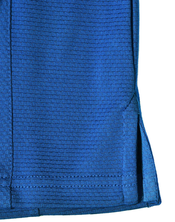 A blue bamboo charcoal polo shirt featuring a textured pattern and side slits, with a logo.