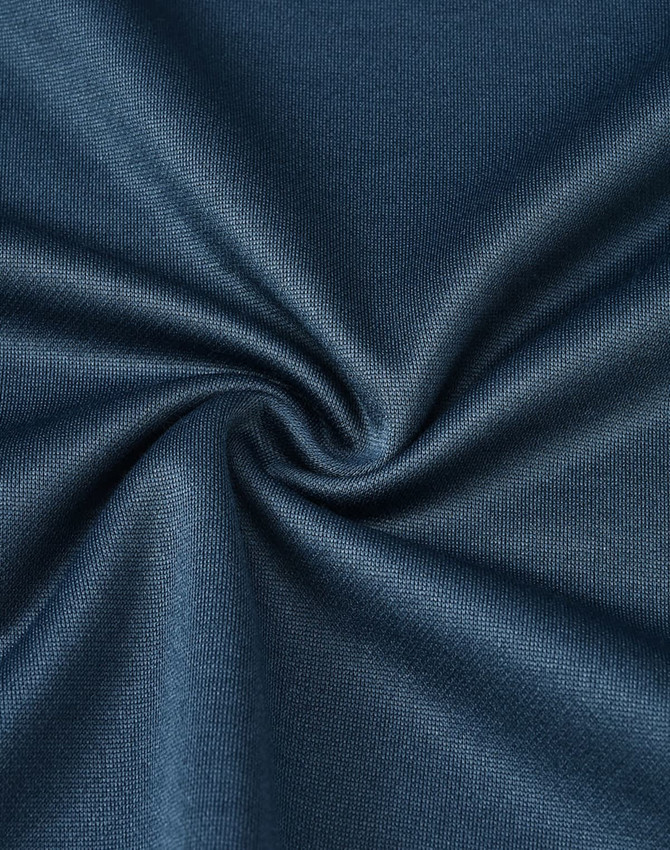 A dark teal fabric swatch, showcasing a soft, sustainable poly/cotton blend with a smooth texture.